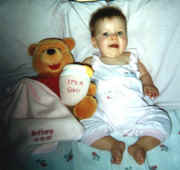 9 7 98 brittany with her special pooh bear from aunt cheryl and uncle gary in arizona.jpg (124552 bytes)