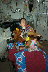 Casey in the hospital on Sat with stuff.jpg (97939 bytes)