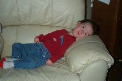 Colin in red and jeans on recliner.jpg (55341 bytes)